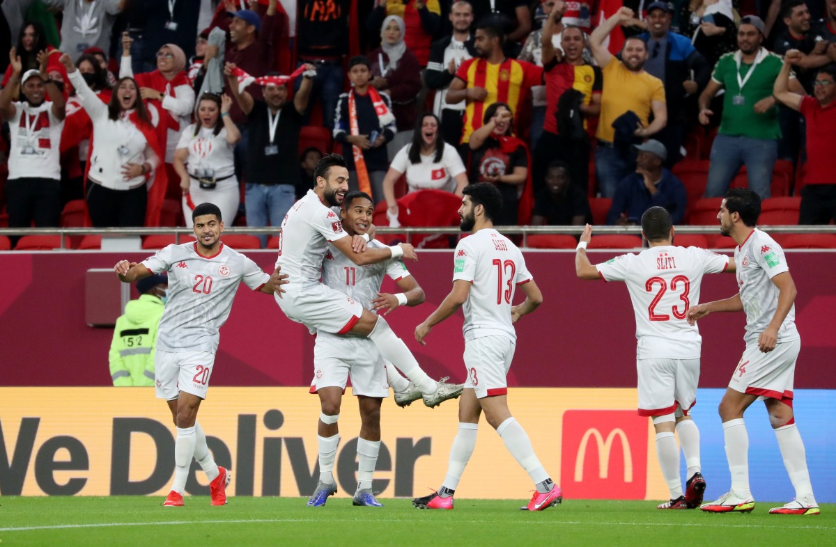 Tunisia’s Jaziri Seifeddine celebrates with team-mates after scoring against the United Arab Emirates at Al Thumama Stadium, on Monday.