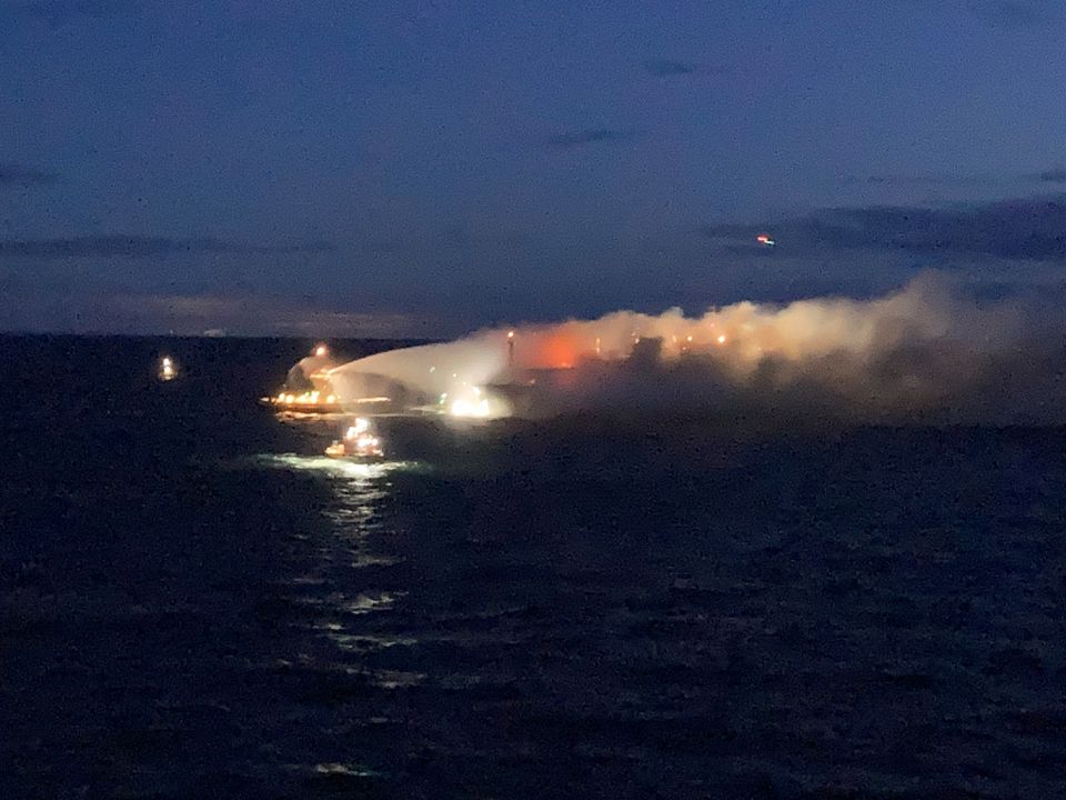 Firefighting boats work as timber cargo burns on the Liberian-flagged Almirante Storni bulk carrier, off Gothenburg, Sweden December 4, 2021 in this image obtained from social media. Picture taken December 4, 2021. Mikael Holst Mattsson via REUTERS/Files

