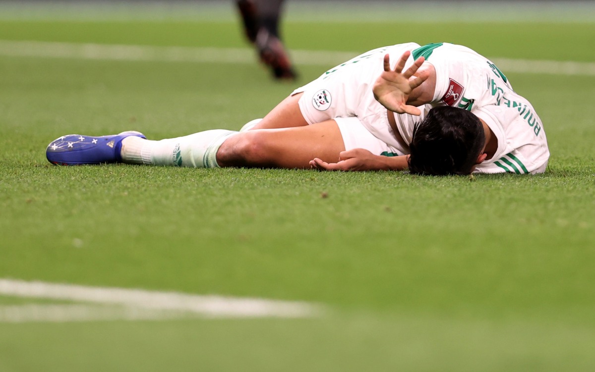 Algeria’s Baghdad Bounedjah reacts after sustaining an injury during the match against Egypt on Tuesday.