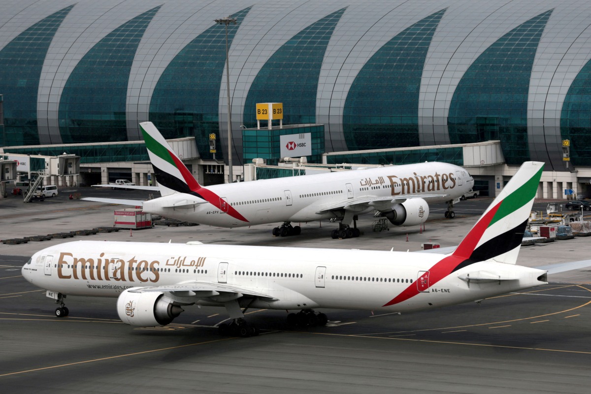 FILE PHOTO: Emirates Airline Boeing 777-300ER planes are seen at Dubai International Airport in Dubai, United Arab Emirates, February 15, 2019. REUTERS/Christopher Pike/File Photo
