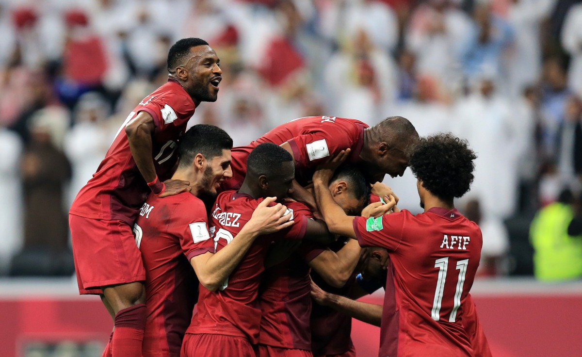 Qatar players celebrate. 