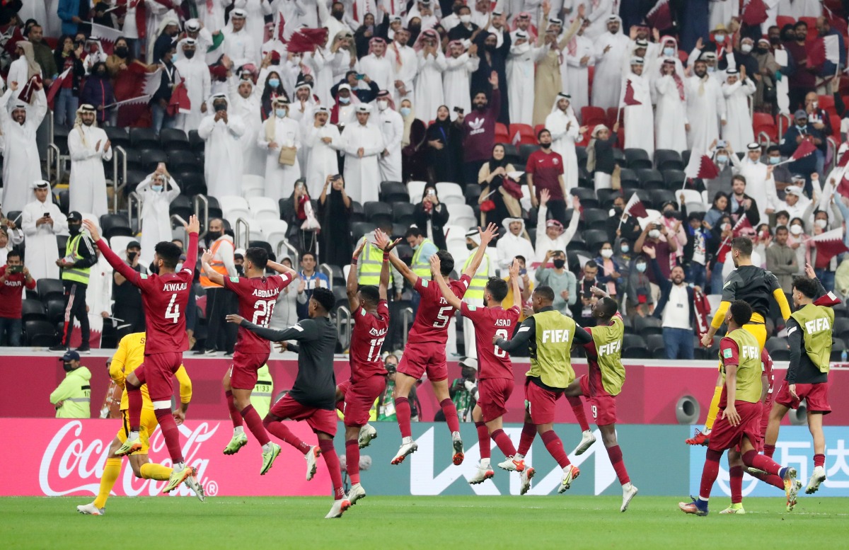 Qatar players celebrate with fans after the quarter-final against the United Arab Emirates.