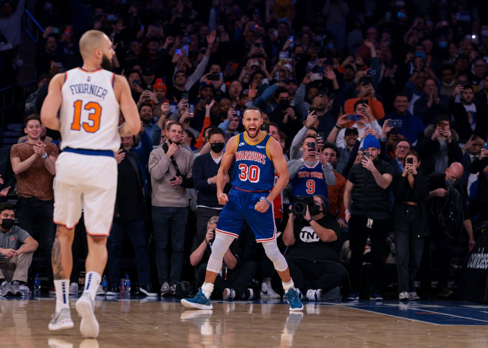 Golden State Warriors guard Stephen Curry (30) reacts after a three-point basket made during the first quarter against the New York Knicks at Madison Square Garden. Vincent Carchietta-USA TODAY Sports