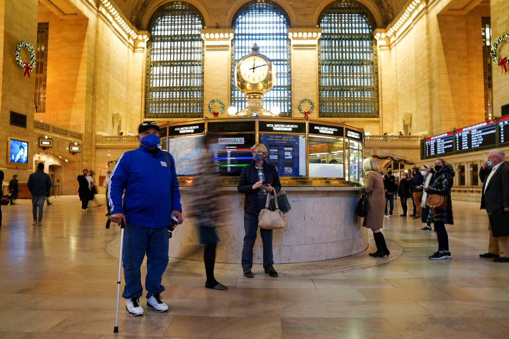 People wearing masks stand in Grand Central Terminal during the coronavirus disease (COVID-19) pandemic, in the Manhattan borough of New York City, New York, U.S., December 14, 2021. Reuters/Carlo Allegri