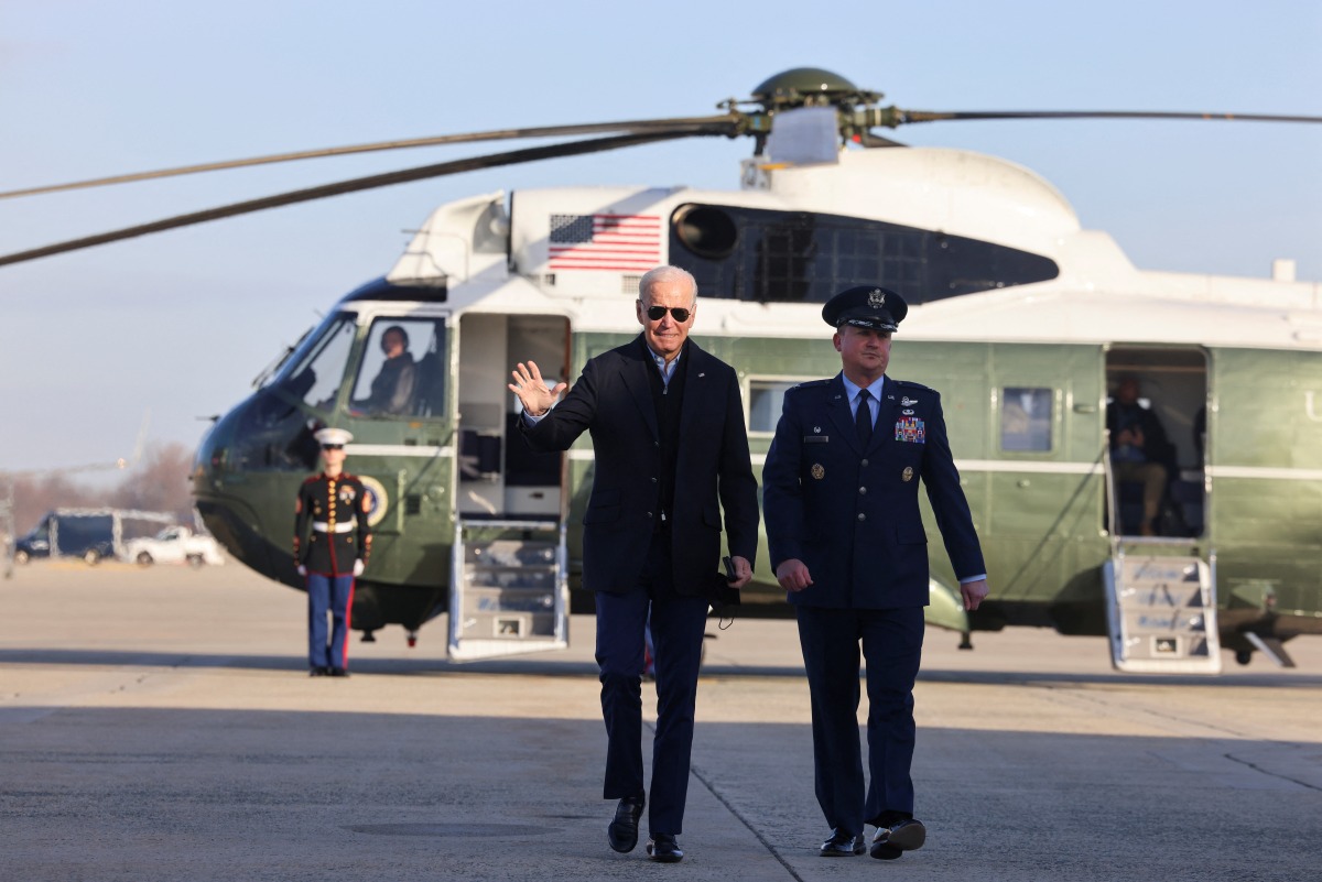 U.S. President Joe Biden walks to depart for Fort Campbell, Kentucky, from Joint Base Andrews in Maryland, U.S., December 15, 2021. REUTERS/Evelyn Hockstein
