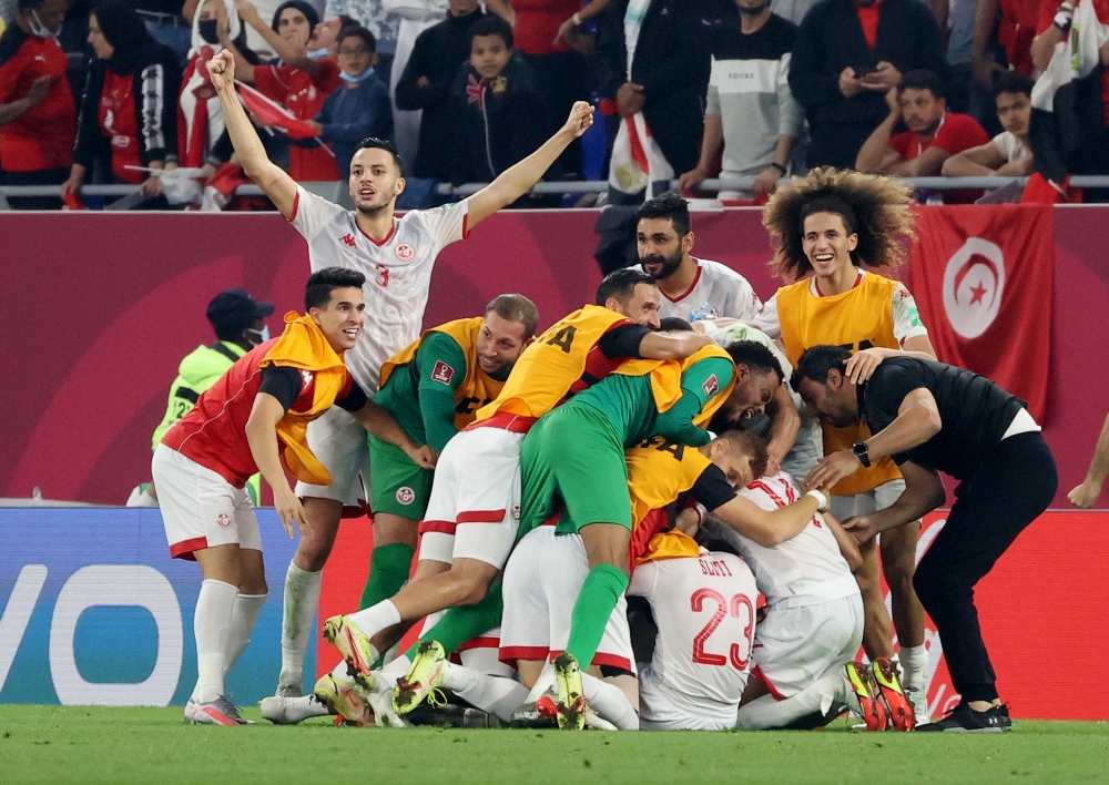 Soccer Football - Arab Cup - Semi-Final - Tunisia v Egypt - 974 Stadium, Doha, Qatar - December 15, 2021 Tunisia players celebrate after the match REUTERS.