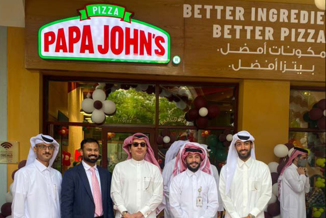 Officials and guests at the opening of a Papa John's outlet in The Pearl-Qatar. 