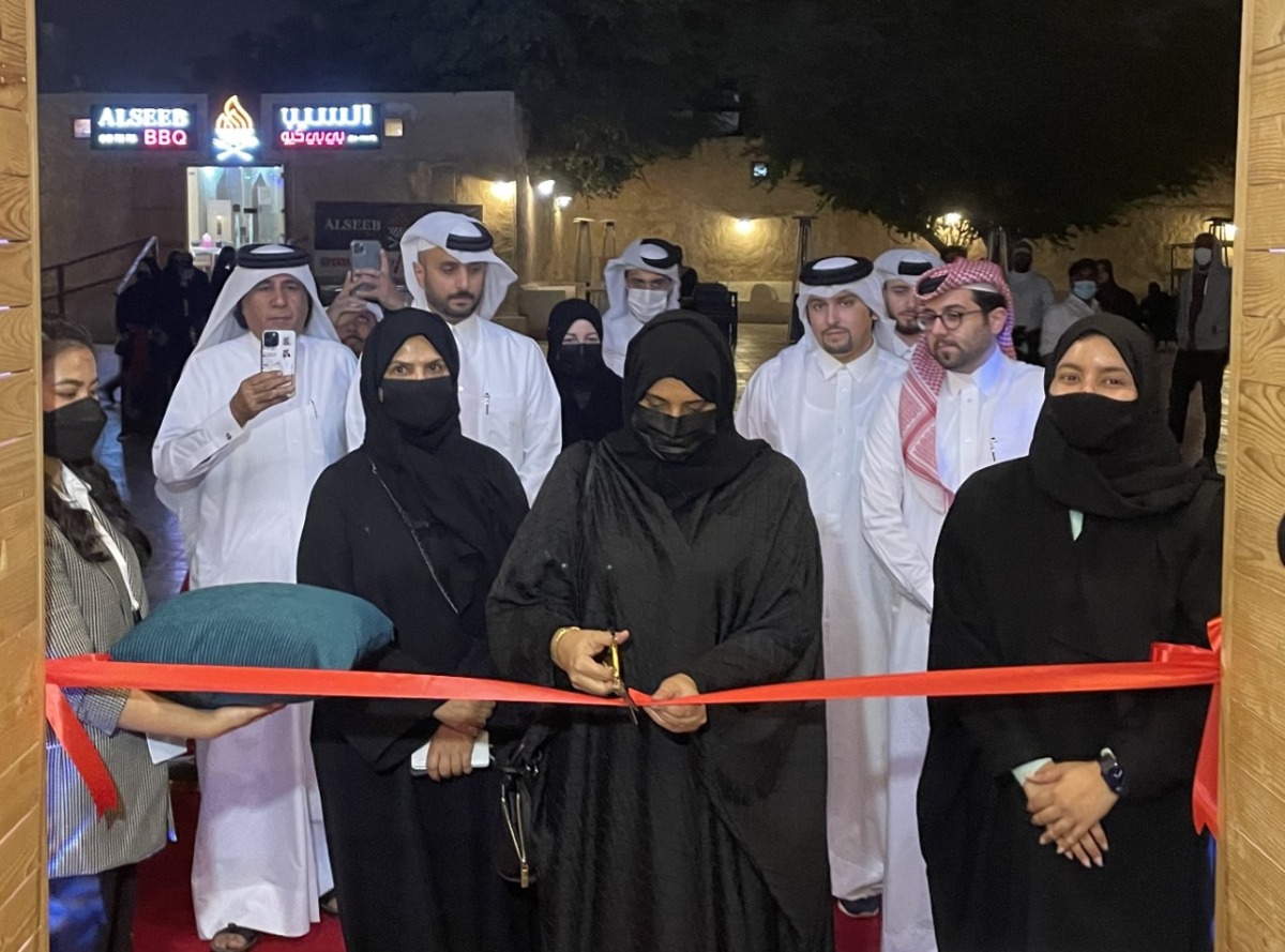 Nama Executive Director Saba Al Fadala cutting the ribbon to mark the opening of Nama Winter Carnival in Souq Wakra, yesterday. Also seen are Nama officials and ExxonMobil representative, which is the platinum sponsor of the event.  Pic: Joelyn Baluyut/The Peninsula