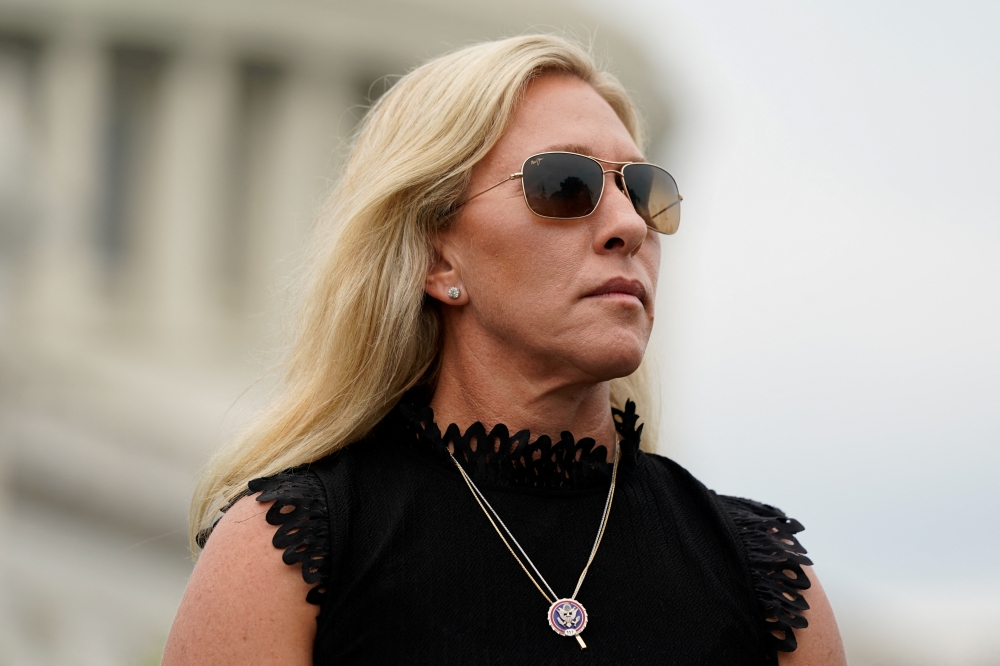 File photo: US Rep. Marjorie Taylor Greene (R-GA) listens as Rep. Matt Gaetz (R-FL) speaks during a news conference outside the US Capitol in Washington, US, July 29, 2021. Reuters/Elizabeth Frantz/File Photo