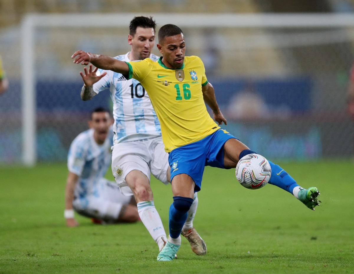 Argentina's Lionel Messi in action with Brazil's Renan Lodi REUTERS/Ricardo Moraes/File Photo