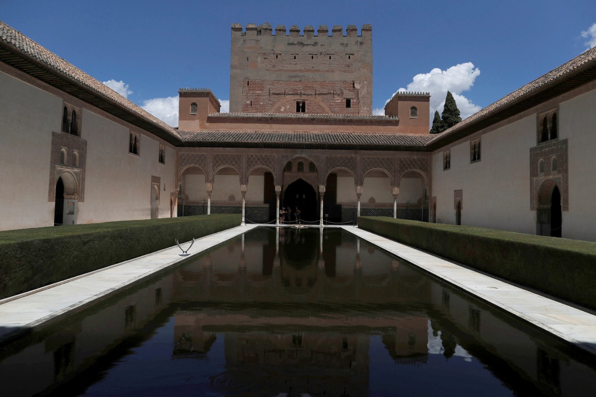 FILE PHOTO: Tourists visit the Alhambra Palace in Granada, Spain June 17, 2020. REUTERS/Jon Nazca/File Photo
