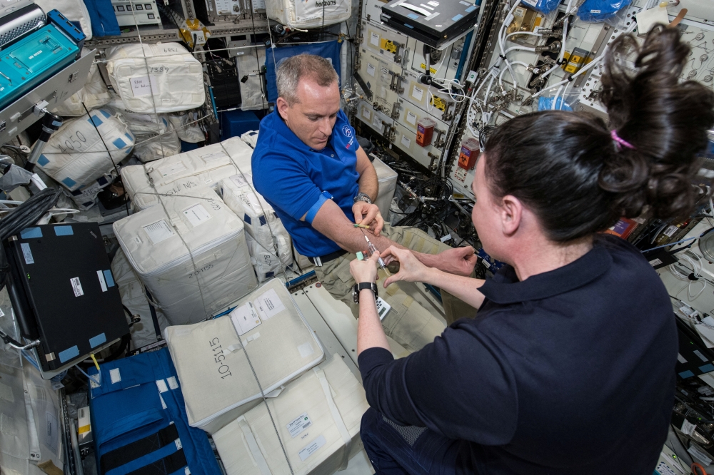 David Saint-Jacques has his blood drawn aboard the International Space Station in this undated handout photo obtained by Reuters on January 14, 2022. NASA/Handout via REUTERS