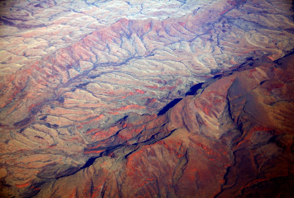 A general view of dried-up river beds and hills in the Pilbara region of Western Australia December 2, 2013. REUTERS/David Gray/File Photo