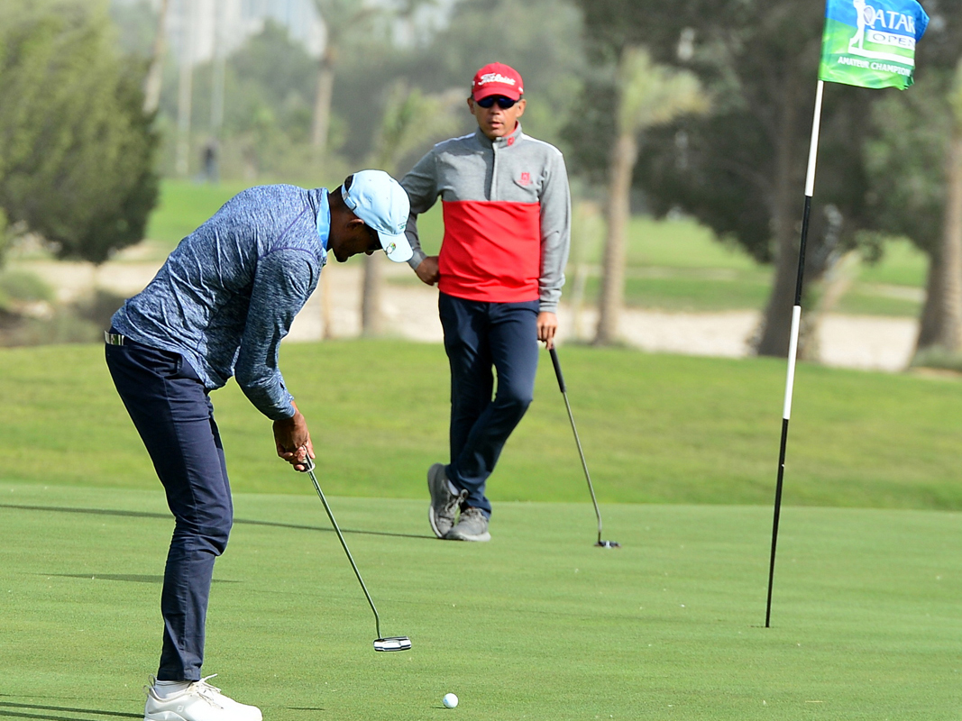 Golfers in action at the Doha Golf Club  yesterday.