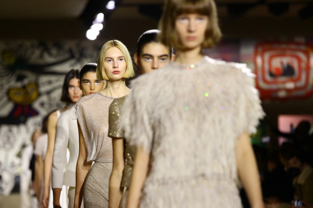 Models present creations by designer Maria Grazia Chiuri as part of her Haute Couture Spring-Summer 2022 collection show for fashion house Dior in Paris, France, January 24, 2022. REUTERS/Violeta Santos Moura
