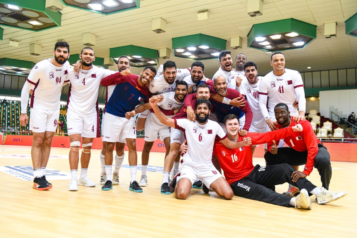 Qatar players celebrate their win over  Uzbekistan on Monday.