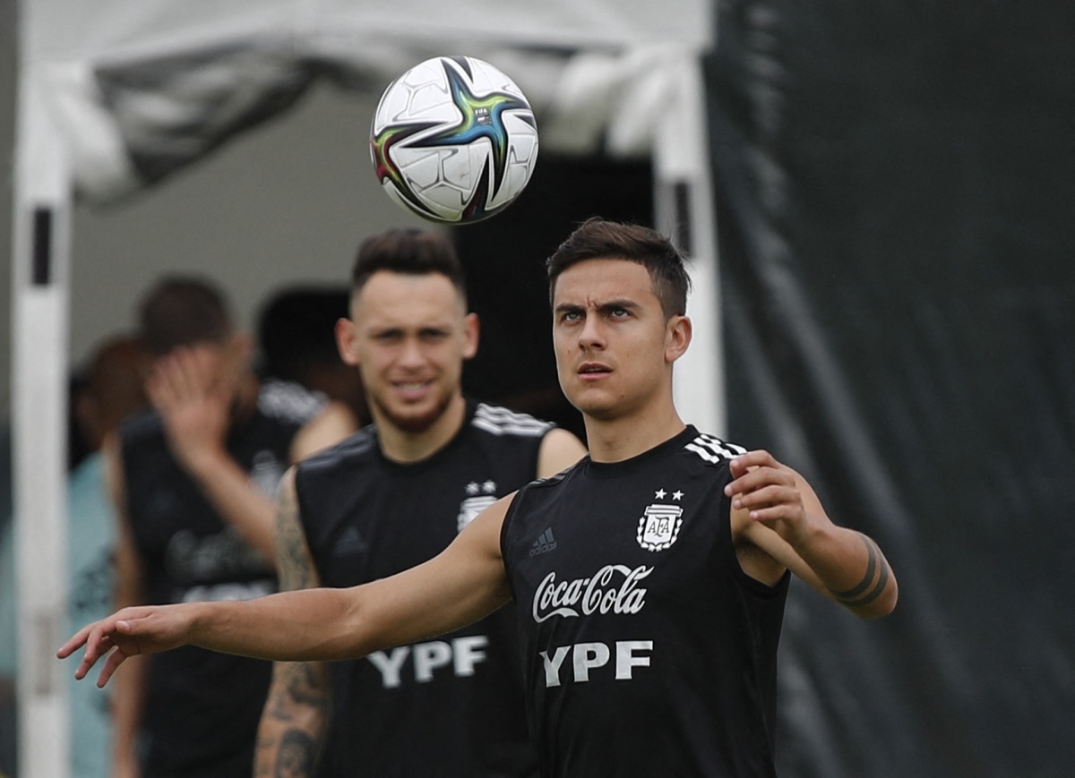 Argentina’s Paulo Dybala with a team-mate during a  training session, yesterday.