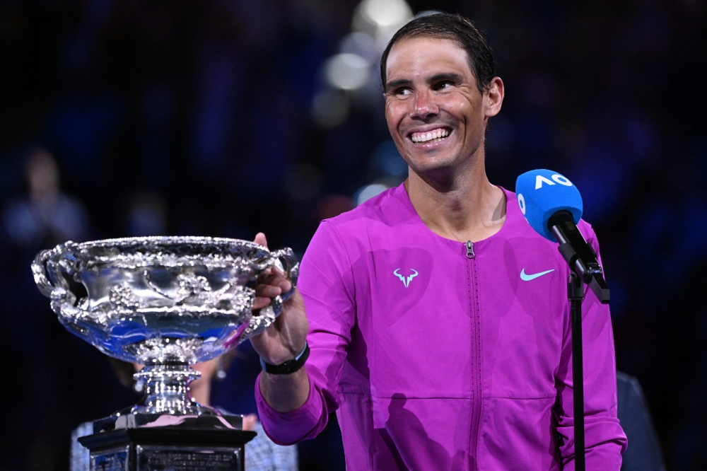 Spain's Rafael Nadal gives a speech to celebrates winning the men's singles final with trophy REUTERS/Emeahub Aws