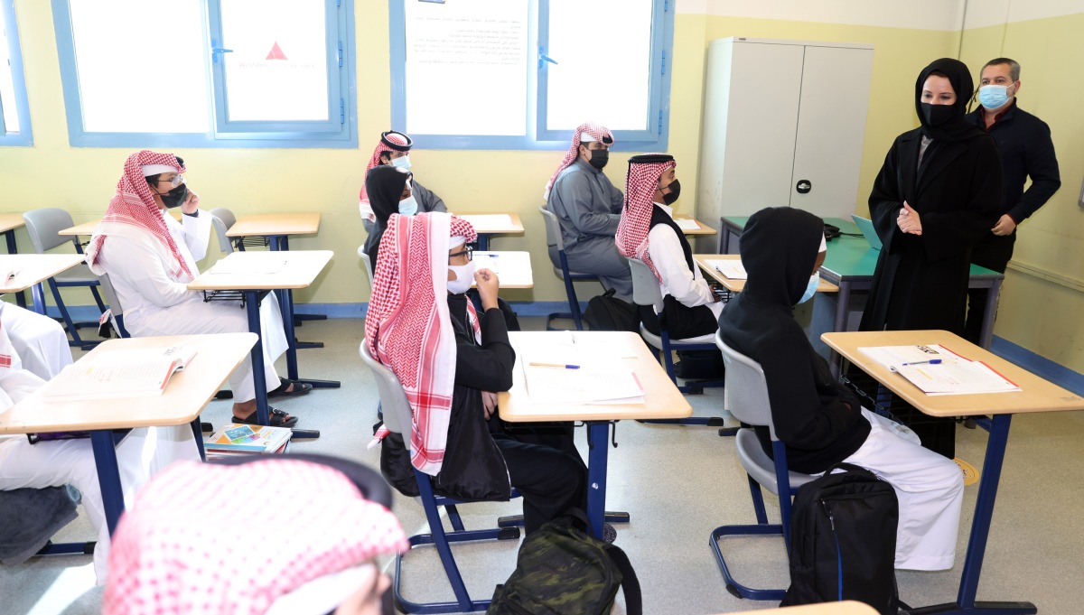 Minister of Education and Higher Education H E Buthaina bint Ali Al Jabr Al Nuaimi interacting with students at a government school.