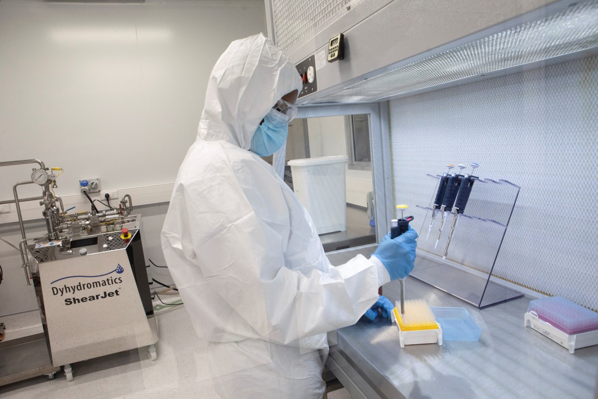 A production scientist works with samples during a visit by representatives of the Medicines Patent Pool, France and other European Union member states, at the Afrigen Biologics' site in Cape Town, South Africa, February 3, 2022. REUTERS/Shelley Christians
