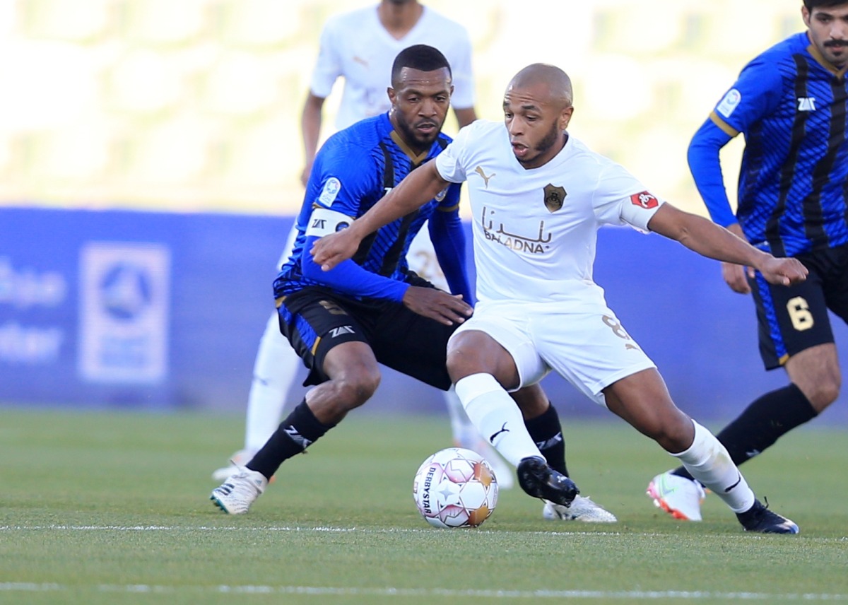 Al Rayyan's Yacine Brahimi vies for the ball with an Al Sailiya player. Pic: Hussein Sayed