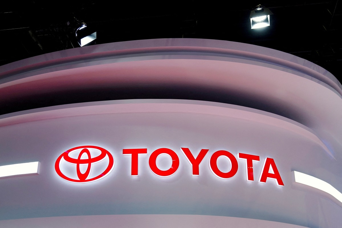 FILE PHOTO: The Toyota logo is seen at a booth during a media day for the Auto Shanghai show in Shanghai, China, April 19, 2021. REUTERS/Aly Song/File Photo
