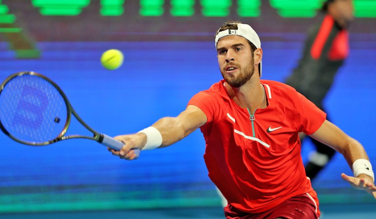 Karen Khachanov returns the ball to Mackenzie McDonald during their Round of 32 match, yesterday.