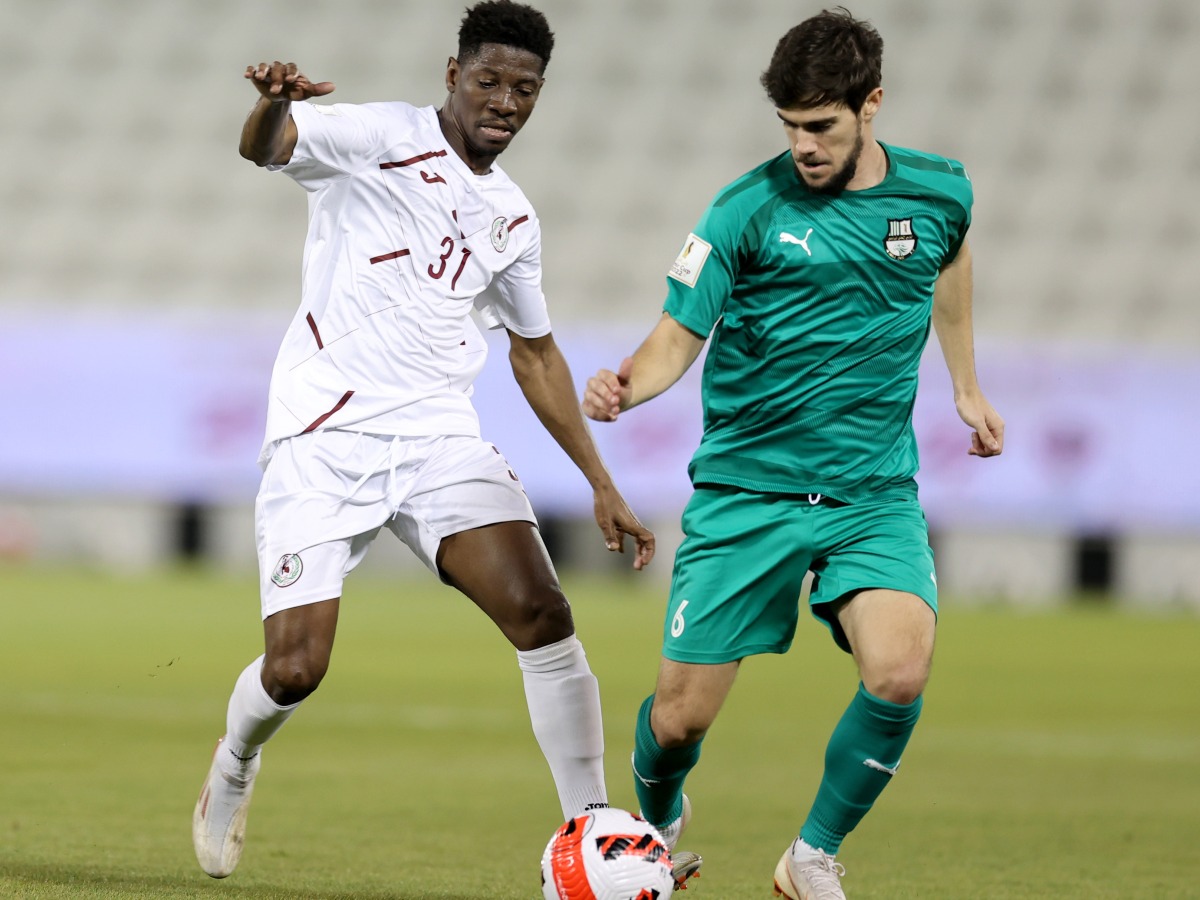 Action during the match between Al Ahli and Al Markhiya.