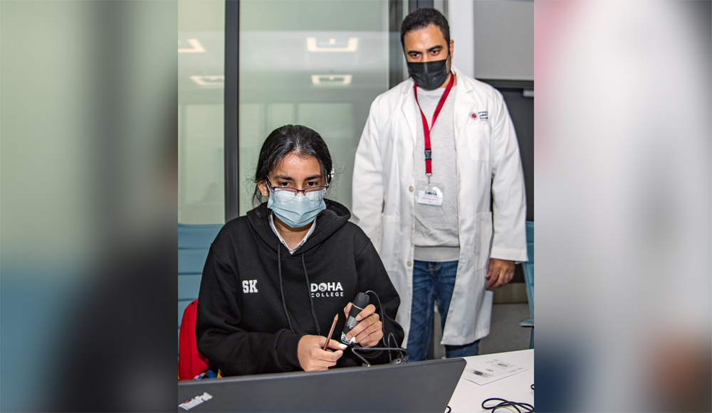 A student checking on fingerprint analysis.