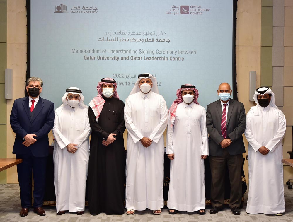 Officials of Qatar University (QU), and Qatar Leadership Centre (QLC) after signing the MoU.