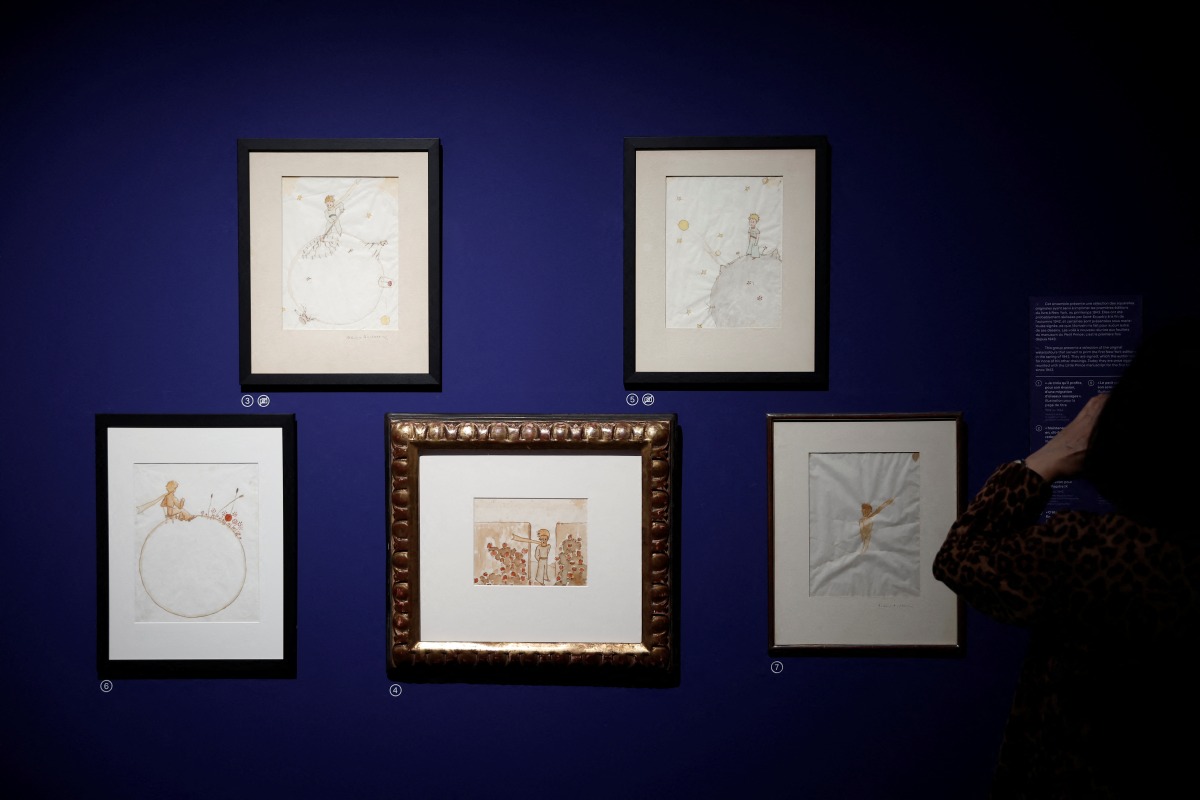 An installation showing works related to the literary masterpiece, The Little Prince, by French writer Antoine de Saint Exupery is seen during the exhibition 