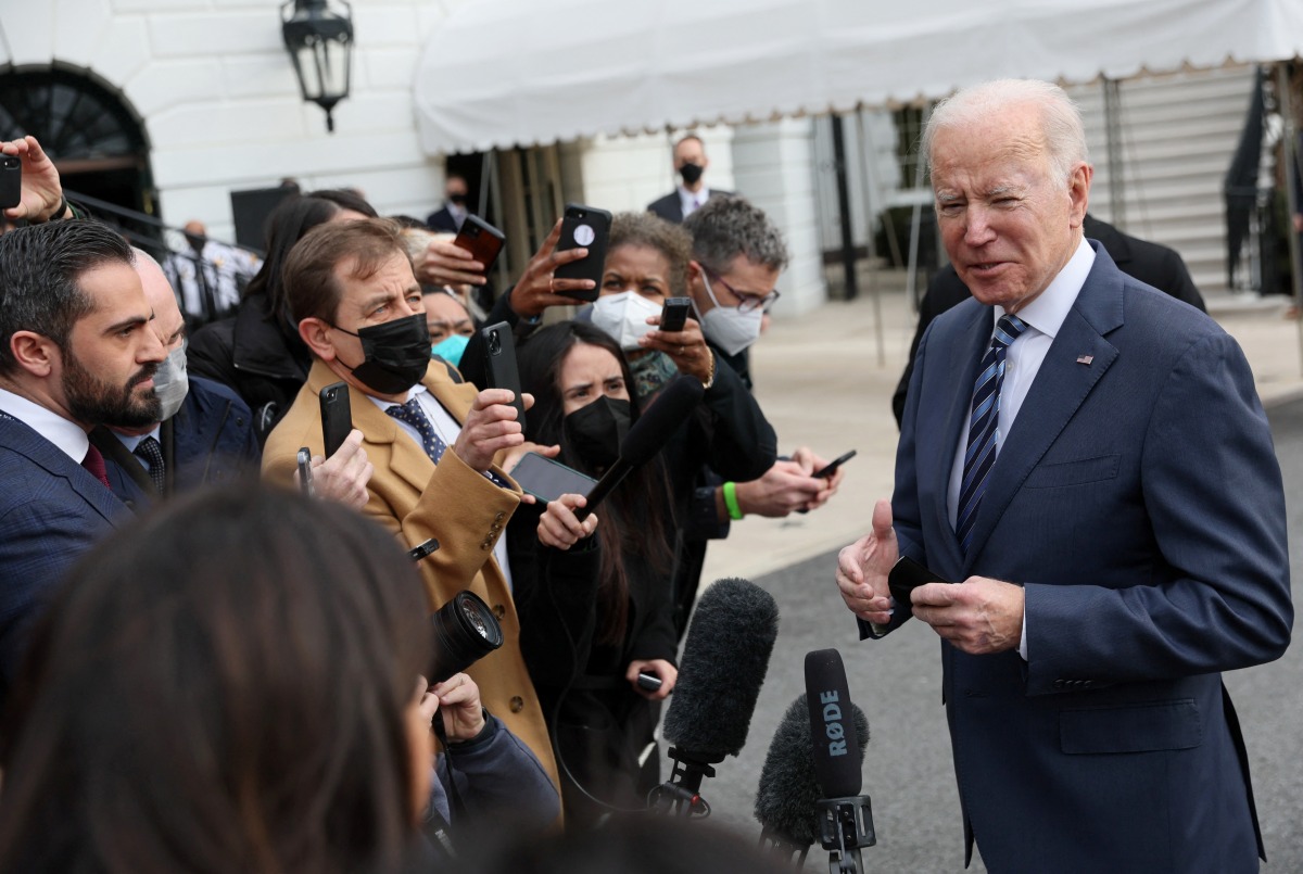 U.S. President Joe Biden speaks to the news media about the situation in Ukraine before boarding Marine One for travel to Ohio from the South Lawn of the White House in Washington, U.S., February 17, 2022. REUTERS/Leah Millis
