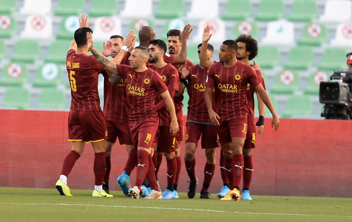 Al Sadd players celebrate after winning the match as they sealed their 16th QSL title.