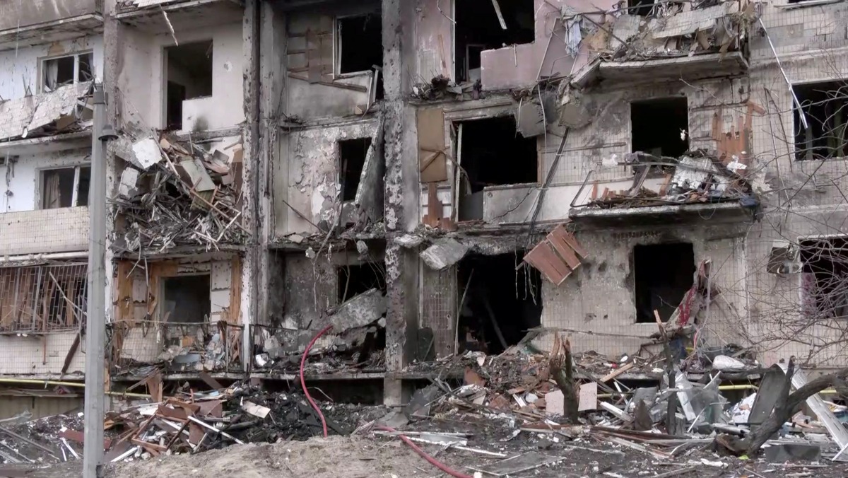 Screengrab from video shows a heavily damaged apartment building after overnight rocket attacks by Russian forces on the country's capital Kyiv, Ukraine February 25, 2022. Reuters TV via REUTERS
