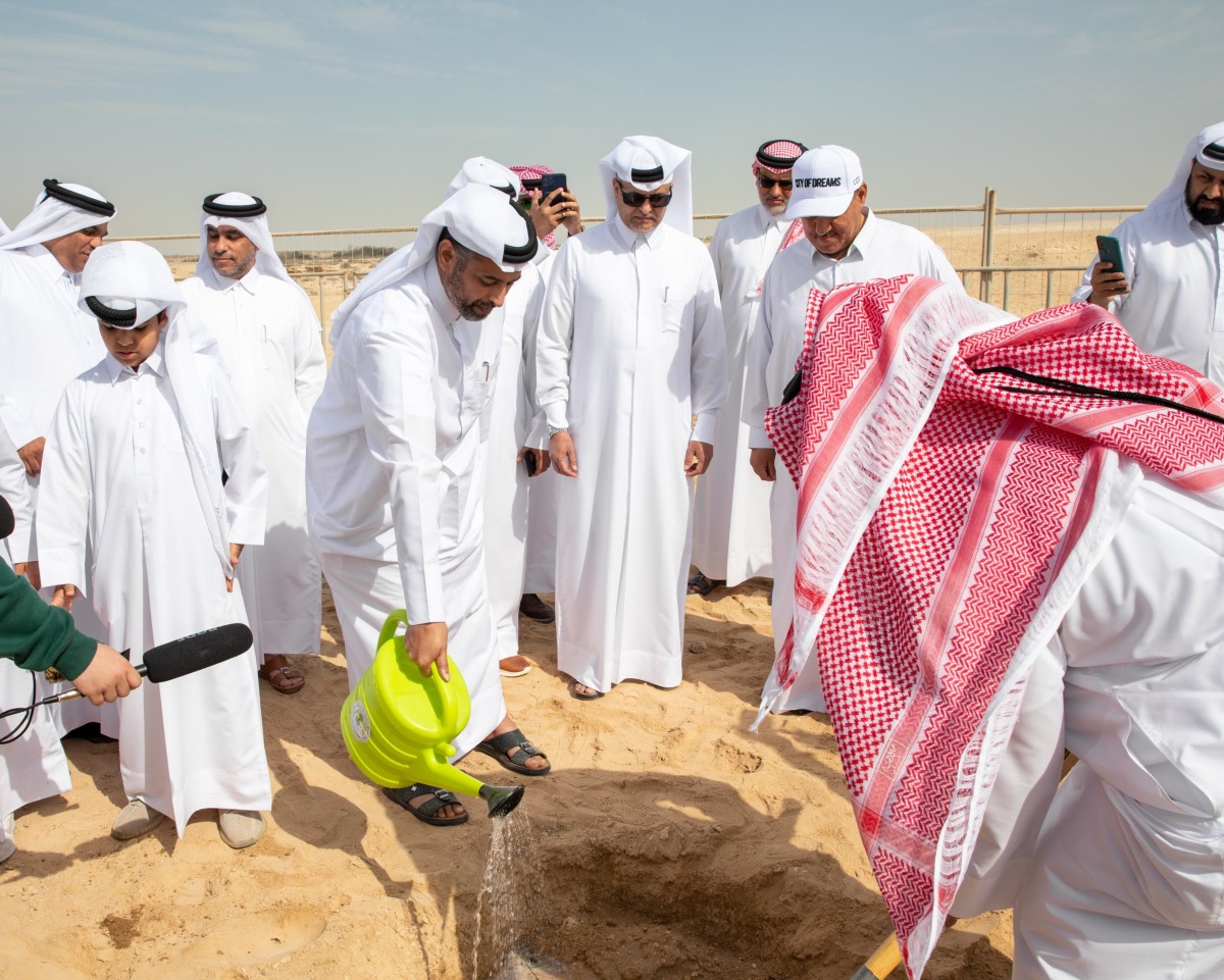 Minister of Environment and Climate Change H E Sheikh Dr. Faleh bin Nasser bin Ahmed bin Ali Al Thani joins officials in planting a tree at Barouq Reserve to mark Qatar Environment Day 2022, yesterday.