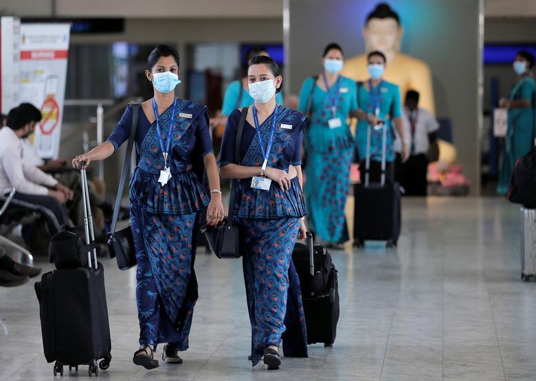 FILE PHOTO: Sri Lankan Airlines staff wear masks at Bandaranaike International Airport after Sri Lanka confirmed the first case of coronavirus in the country, in Katunayake, Sri Lanka January 30, 2020. REUTERS/Dinuka Liyanawatte