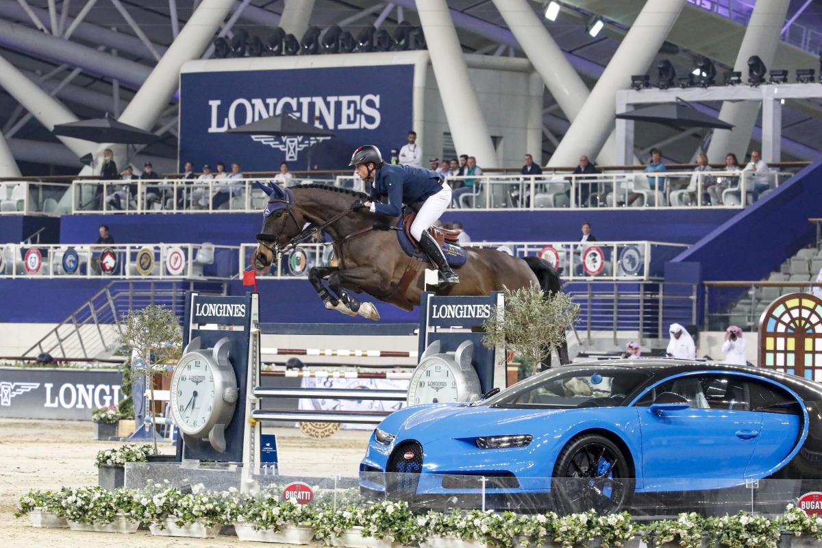 Martin Fuchs guides Conner Jei over a fence during the 1.55m jump-off at the Longines Arena, yesterday.