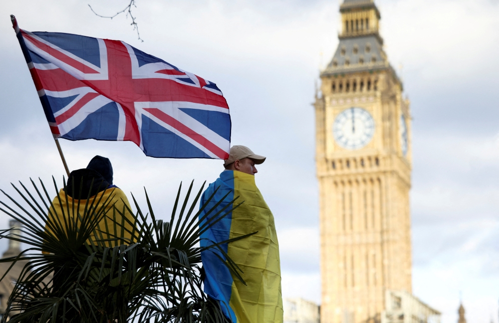 File photo: A demonstrator holds a British flag during a protest against Russia's invasion of Ukraine, at Parliament Square in London, Britain, March 6, 2022. Reuters/Henry Nicholls/File Photo