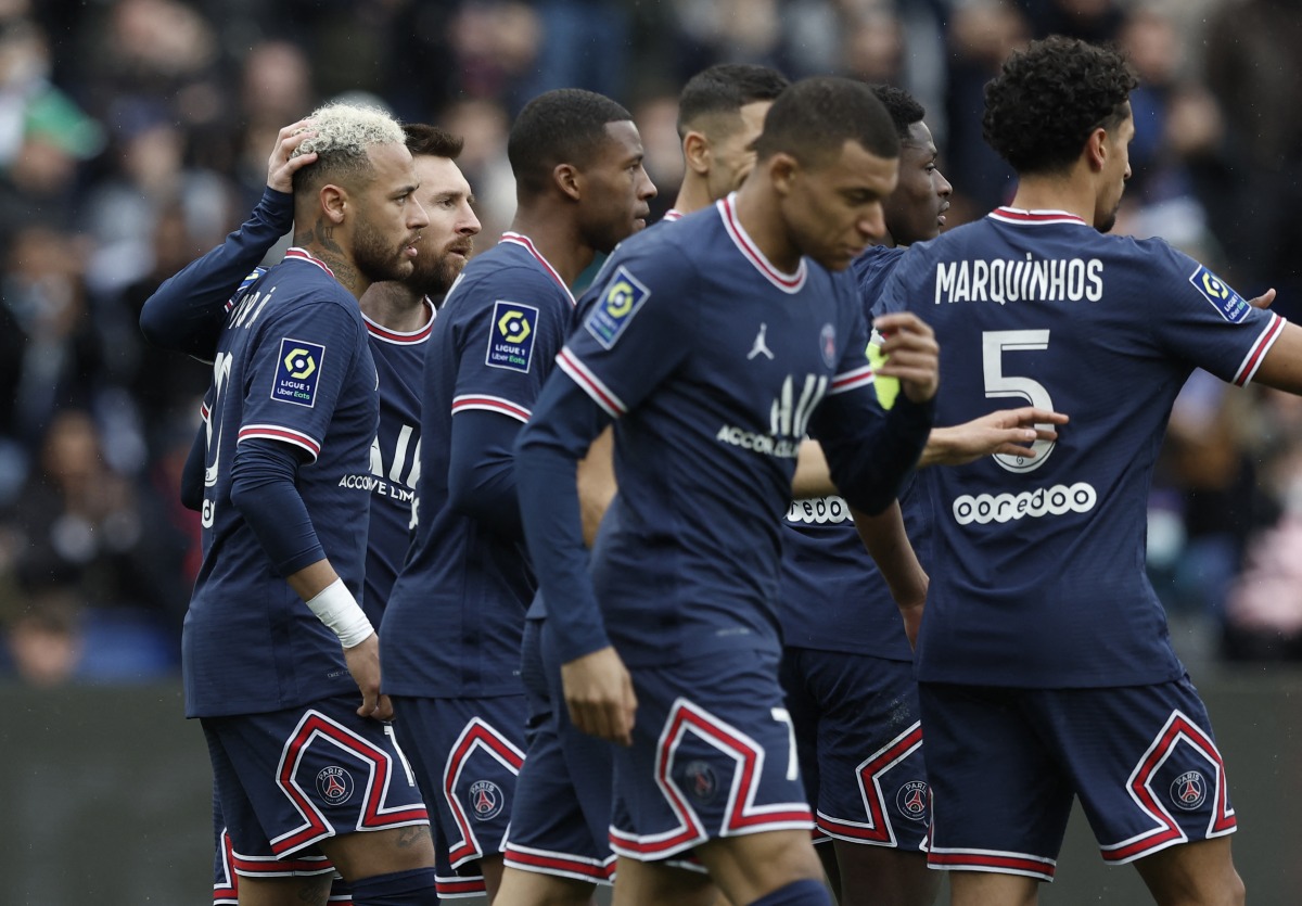 March 13, 2022 Paris St Germain's Neymar celebrates scoring their second goal with Lionel Messi and teammates REUTERS/Benoit Tessier
