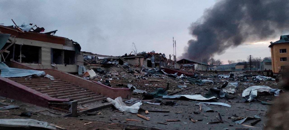 Smoke rises amid damaged buildings following an attack on the Yavoriv military base, as Russia's invasion of Ukraine continues, in Yavoriv, Lviv Oblast, Ukraine, March 13, 2022 in this picture obtained from social media. @BackAndAlive/via REUTERS