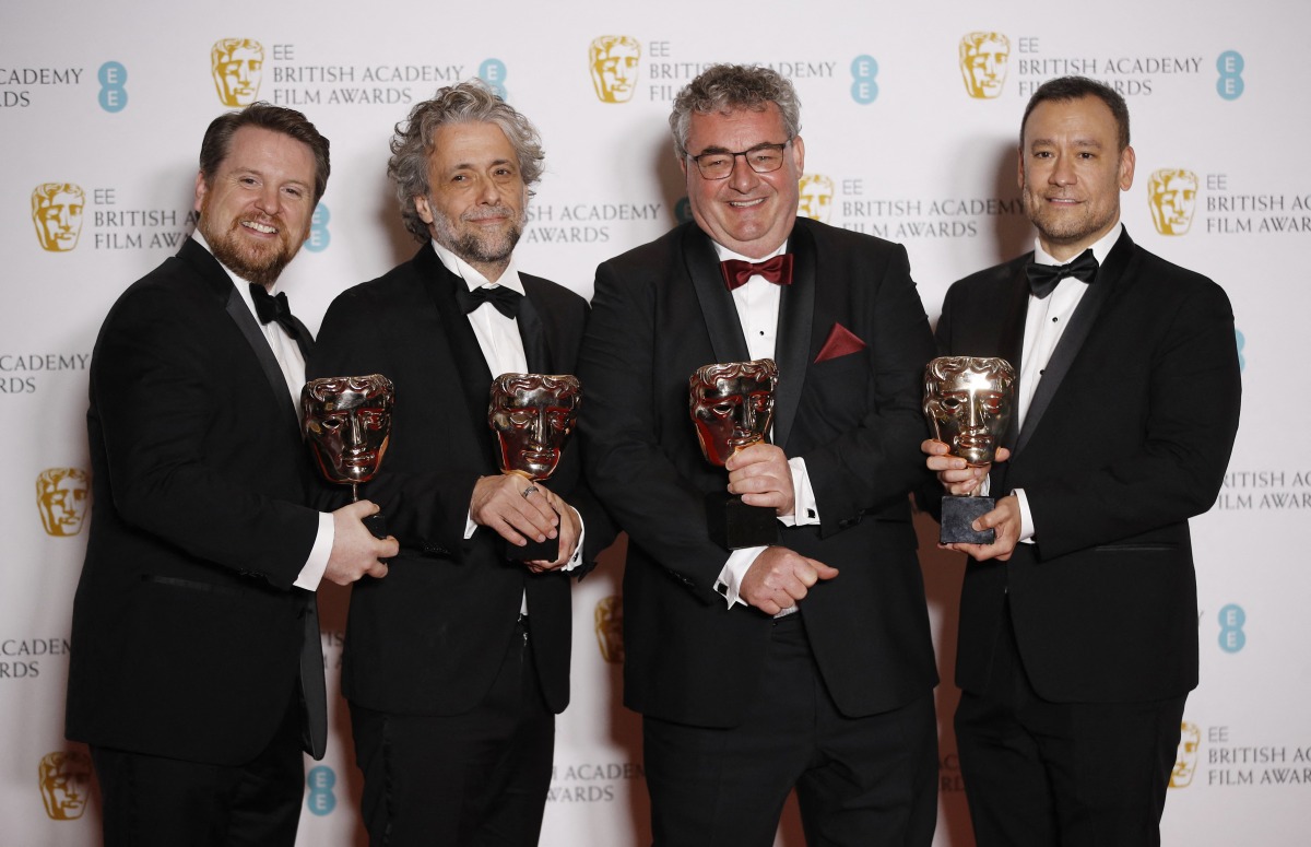 Brian Connor, Paul Lambert, Tristan Myles and Gerd Nefzer pose with their award for Best Special Visual Effects for 