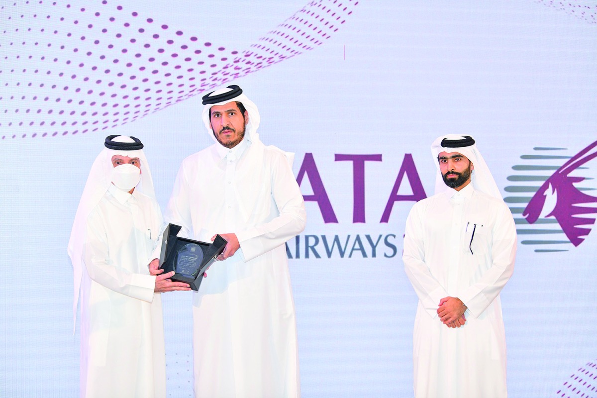 Minister of Commerce and Industry H E Sheikh Mohammed bin Hamad bin Qassim Al Thani presenting an award to Qatar Airways Group Chief Executive and Chairman of Qatar Tourism H E Akbar Al Baker during the inauguration of the ‘National Product Week’.