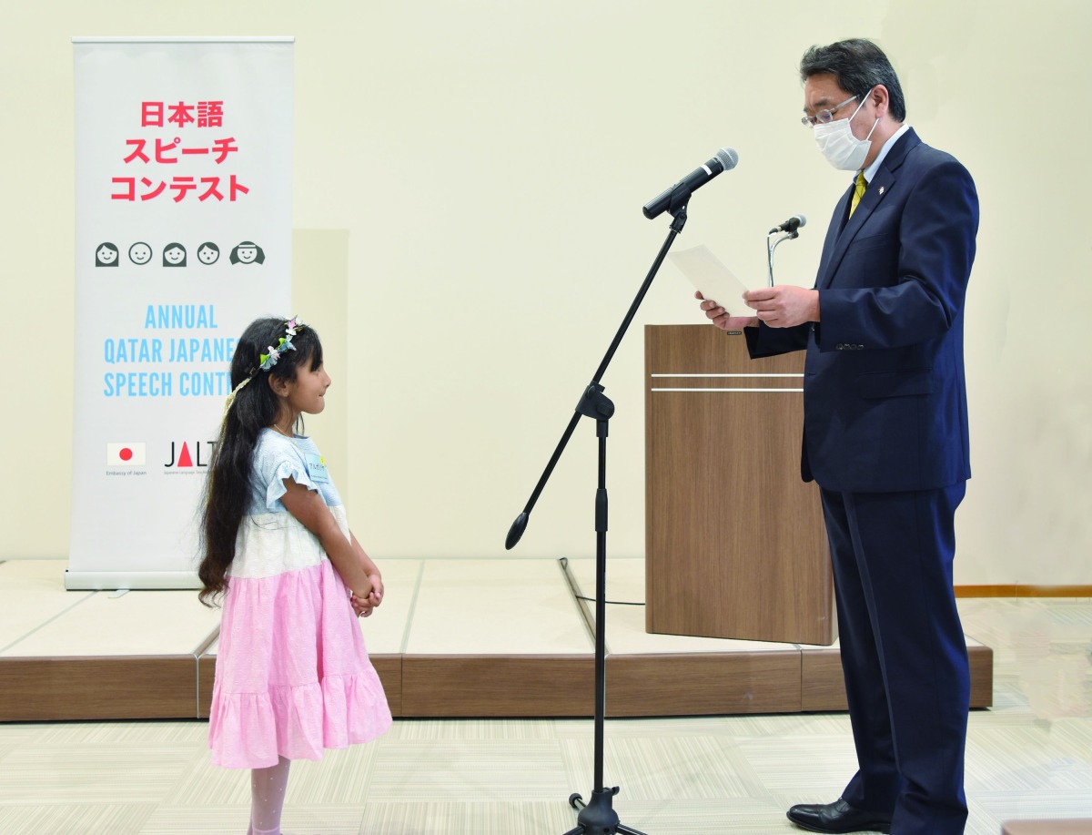 Ambassador H E Satoshi Maeda with a participant during the13th Japanese Speech Contest.