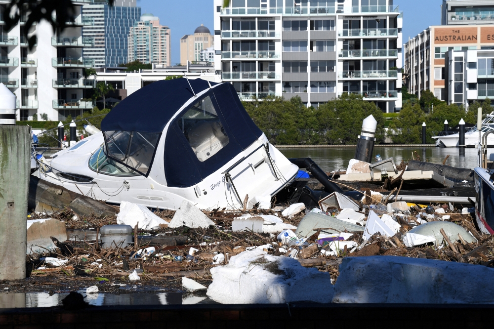 Boats and other debris are seen washed into Hawthorne ferry terminal by the force of floodwaters following heavy rains in Brisbane, Queensland, Australia March 2, 2022. AAP Image/Darren England via REUTERS