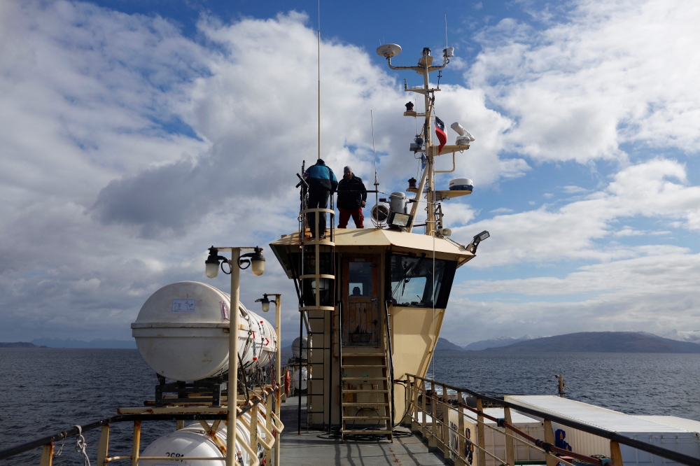 Project Manager Manuel Unruh works on a 'FerryBox', a device that will measure water temperature, oxygen, salinity, chlorophyll, CO2 concentration and Ph in the subantarctic seas, in Punta Arenas, in Magallanes area, Chile March 18, 2022. Picture taken March 18, 2022. REUTERS/Sofia Yanjari