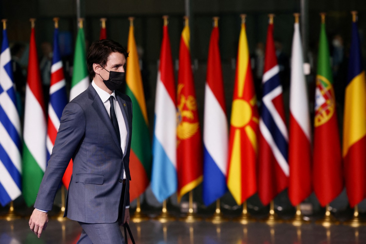 Canada's Prime Minister Justin Trudeau leaves NATO Headquarters following a NATO summit on Russia's invasion of Ukraine, in Brussels, Belgium March 24, 2022. REUTERS/Henry Nicholls/Pool
