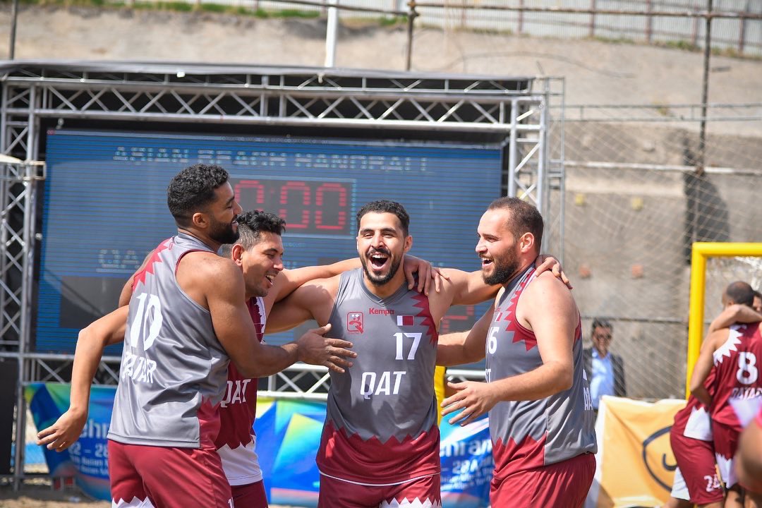 Qatar players celebrate during the Asian Beach Handball Championship.