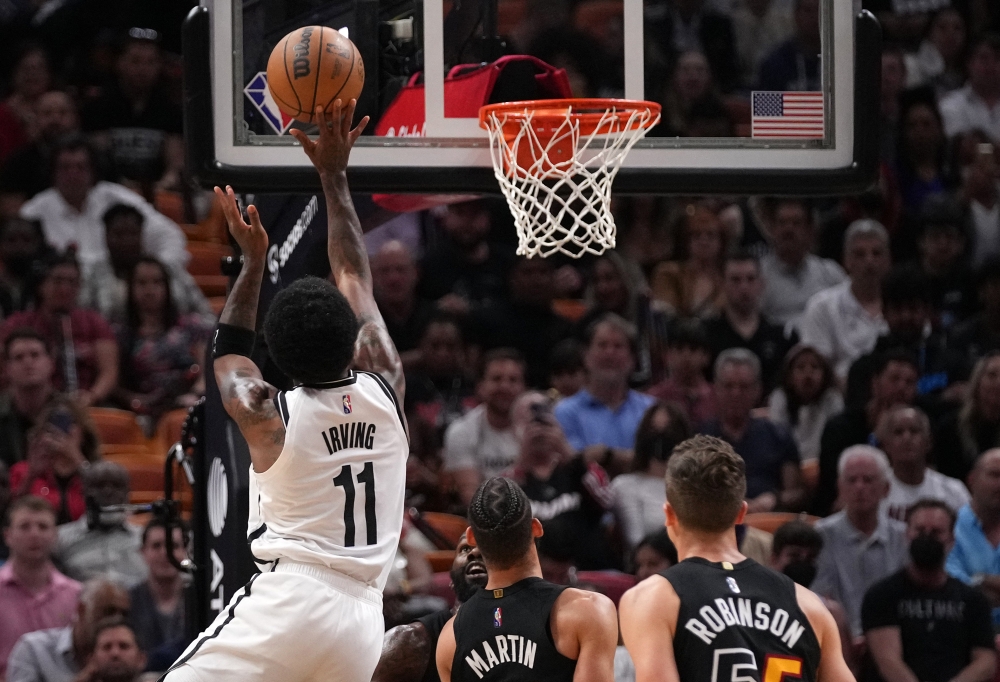 Brooklyn Nets guard Kyrie Irving (11) puts up a shot against the Miami Heat during the first half at FTX Arena. Jasen Vinlove