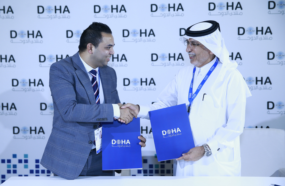 Jaber Salem Al Harami, Deputy CEO of Dar Al Sharq Group, and Dr. Sanjay Kumar from The Korea Herald at the MoU signing event, on the sidelines of Doha Forum yesterday. PIC: RAJAN VADAKKEMURIYIL