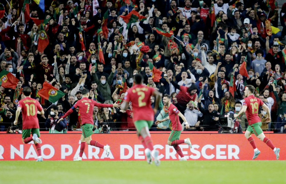 Portugal's Bruno Fernandes celebrates scoring their first goal with teammates Reuters/Miguel Vidal